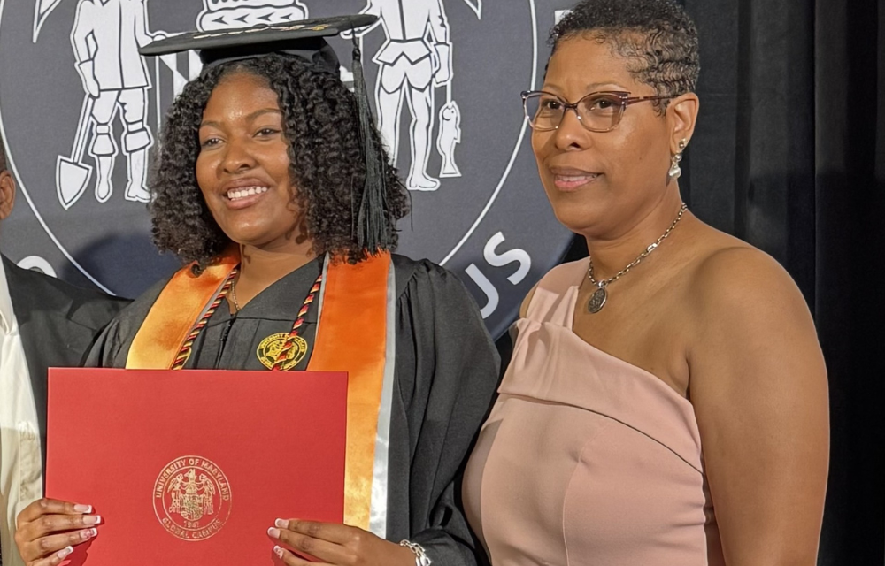 Erin Barnes accepting her degree with her mother Erica Barnes by her side